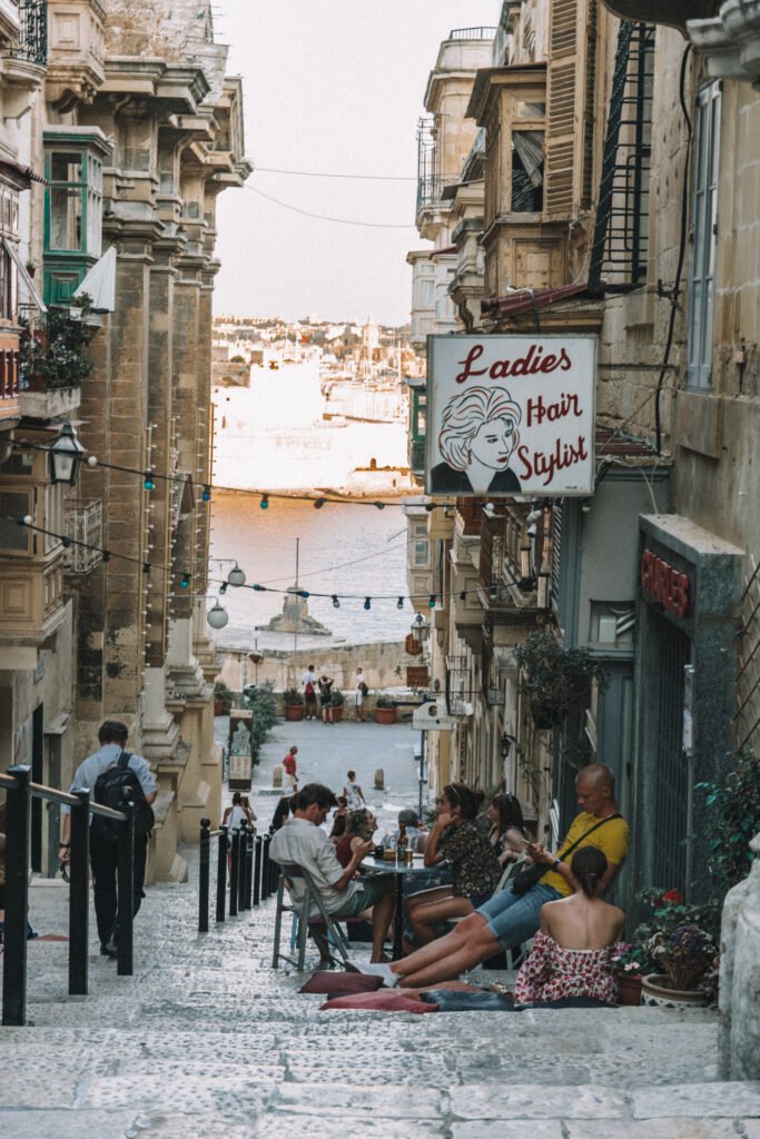 People having dinner on a cozy street in Valetta Malta