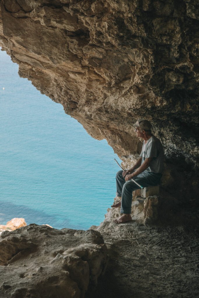 Guy looking out of Tal-Mixta Cave