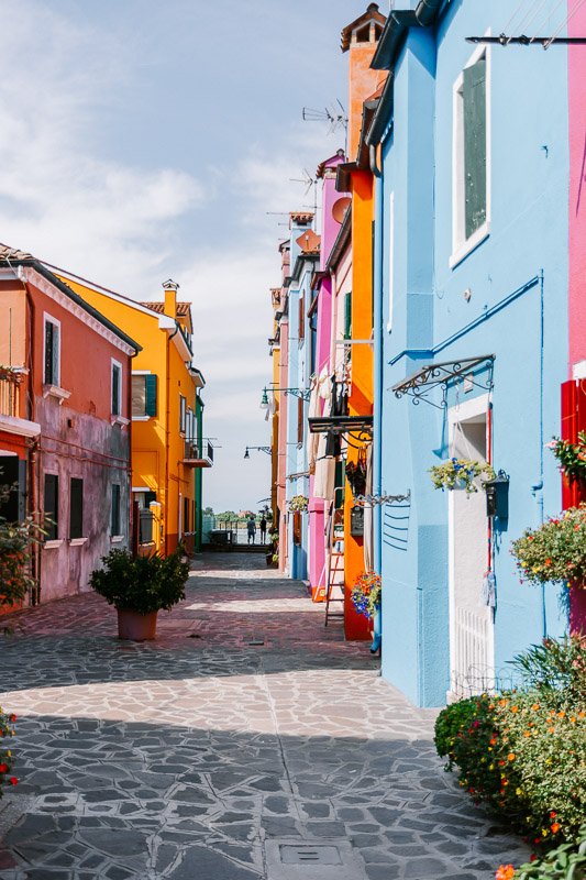 The colourful houses on the canals of Burano are a must visit from Venice Italy