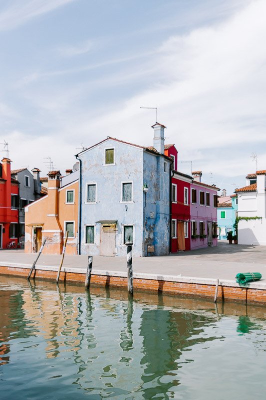 The colourful houses on the canals of Burano are a must visit from Venice Italy