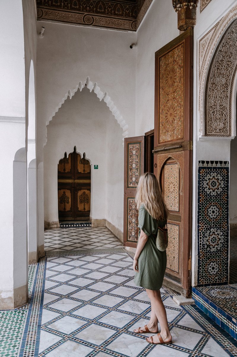 Girl walking inside the Bahia Palace which is one of the fun things to visit in Marrakech Morocco
