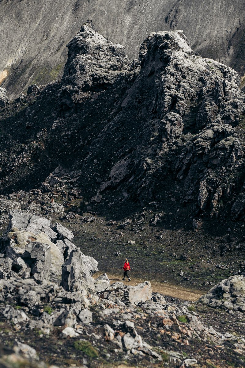 Girl hiking in a red jacket in Landmannalaugar